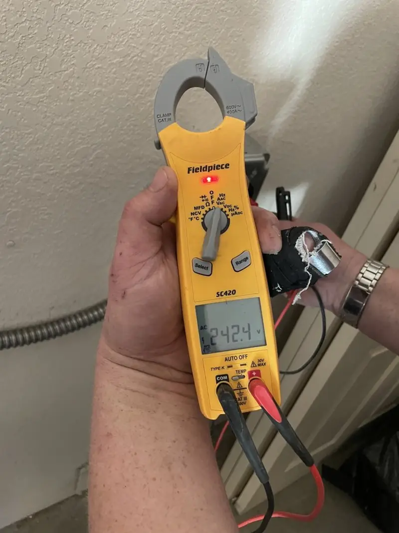 Voltage testing with clamp meter during Outlet Installation in Riverside